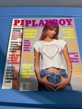 PLAYBOY cover spread with black, white and blue accents